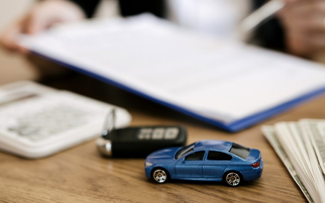 Car on table with money and insurance