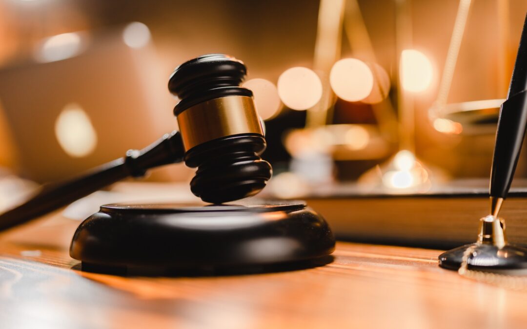 Law gavel with pen on desk